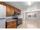 A view of the kitchen, which includes granite counters and stainless steel appliances at 452 S Horne --, Mesa, AZ 85204