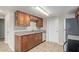 Bright kitchen featuring wood cabinets and stainless steel appliances at 452 S Horne --, Mesa, AZ 85204