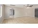 Bright living room showcasing tile flooring, neutral walls, and arched doorways at 452 S Horne --, Mesa, AZ 85204