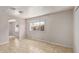 The living room has neutral walls, tile flooring, and a large window at 452 S Horne --, Mesa, AZ 85204