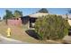 A cozy home featuring desert landscape and a fire hydrant out front with a carport on the side of the house at 4613 N 24Th Pl, Phoenix, AZ 85016