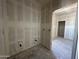 Bathroom with drywall and plumbing fixtures, plus a new bathtub ready for finishing touches at 47219 W Pecan Woods --, Maricopa, AZ 85139