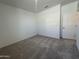 Bedroom with neutral carpet and white walls, window, and an air vent at 47219 W Pecan Woods --, Maricopa, AZ 85139