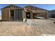 New home under construction with exposed framing and unfinished exterior at 47219 W Pecan Woods --, Maricopa, AZ 85139