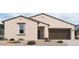 Inviting single-story home with neutral stucco, dark trim, and a two-car garage at 47219 W Pecan Woods --, Maricopa, AZ 85139