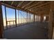 Framed interior with view to the exterior, with window framing and a concrete slab at 47219 W Pecan Woods --, Maricopa, AZ 85139