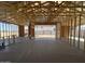 Interior framing of a new home shows large windows at 47219 W Pecan Woods --, Maricopa, AZ 85139