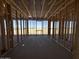 Large, framed interior with window framing and a concrete slab at 47219 W Pecan Woods --, Maricopa, AZ 85139