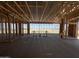 Interior framing of a new home shows an open-concept design at 47219 W Pecan Woods --, Maricopa, AZ 85139