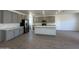Kitchen with an island, stainless steel appliances, and gray cabinets at 47219 W Pecan Woods --, Maricopa, AZ 85139