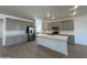 Kitchen with an island, stainless steel appliances, and gray cabinets at 47219 W Pecan Woods --, Maricopa, AZ 85139