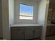 Kitchenette has quartz countertop, grey cabinets and window view at 47219 W Pecan Woods --, Maricopa, AZ 85139