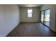 Open living area features tile flooring and sliding glass door to outdoor space at 47219 W Pecan Woods --, Maricopa, AZ 85139