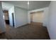 Open living room with tile floors and views of the kitchen at 47219 W Pecan Woods --, Maricopa, AZ 85139