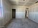 Spacious living room with drywall, ample natural light, and potential for open concept design at 47219 W Pecan Woods --, Maricopa, AZ 85139