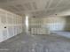 Spacious living room featuring unfinished drywall and high ceilings awaiting personalization to create the perfect space at 47219 W Pecan Woods --, Maricopa, AZ 85139