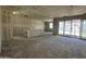 An expansive living room with new drywall, showcasing window views and design flexibility at 47219 W Pecan Woods --, Maricopa, AZ 85139