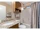 Bathroom showcasing tub and shower combo, a granite countertop, and a mirrored cabinet at 4757 E Goldfinch Gate Ln, Phoenix, AZ 85044