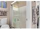 Bathroom featuring a glass-enclosed shower and white toilet, next to towel rack at 4757 E Goldfinch Gate Ln, Phoenix, AZ 85044