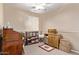 Spare bedroom with nice lighting, neutral carpeting, desk, and storage at 4757 E Goldfinch Gate Ln, Phoenix, AZ 85044