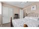 Cozy bedroom featuring a comfortable bed, white sliding door closet, and a ceiling fan at 4757 E Goldfinch Gate Ln, Phoenix, AZ 85044