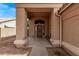 Inviting front entryway features a dark stained front door, tile flooring, and shade from the sun at 4757 E Goldfinch Gate Ln, Phoenix, AZ 85044