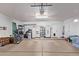 Spacious two-car garage with ample space for parking and storage, side entrance, and high ceilings at 4757 E Goldfinch Gate Ln, Phoenix, AZ 85044