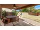 Outdoor patio featuring a relaxing hot tub and seating overlooking the backyard at 4757 E Goldfinch Gate Ln, Phoenix, AZ 85044