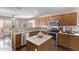 Modern kitchen features stainless steel appliances, a kitchen island, granite countertops, and lots of storage at 4757 E Goldfinch Gate Ln, Phoenix, AZ 85044
