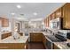 Bright and airy kitchen offers stainless steel appliances, tile backsplash, granite countertops, and lots of storage at 4757 E Goldfinch Gate Ln, Phoenix, AZ 85044