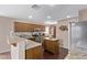 Spacious kitchen with granite countertops, modern appliances, light-stained wood cabinets, and tile backsplash at 4757 E Goldfinch Gate Ln, Phoenix, AZ 85044