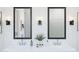 Close-up of a well-appointed double vanity with sleek fixtures and decor at 491 E Aurora Dr, San Tan Valley, AZ 85140