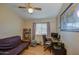 Bedroom with neutral walls, hardwood floor, futon, desk, and world map at 538 E Rockwood Dr, Phoenix, AZ 85024