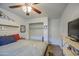 Bright bedroom featuring neutral paint, a ceiling fan, and minimalist decor at 538 E Rockwood Dr, Phoenix, AZ 85024
