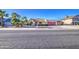 Charming home with desert landscaping, a red garage door, and an inviting brick walkway at 538 E Rockwood Dr, Phoenix, AZ 85024