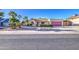 Beautifully landscaped home with desert landscaping, red garage door, and appealing brick pathway at 538 E Rockwood Dr, Phoenix, AZ 85024