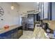Bright kitchen featuring stainless steel appliances, granite counters, and tiled flooring at 538 E Rockwood Dr, Phoenix, AZ 85024