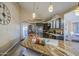 Modern kitchen boasts granite countertops, stainless steel appliances, and decorative lighting at 538 E Rockwood Dr, Phoenix, AZ 85024