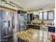 Modern kitchen with stainless steel appliances, granite counters, and ample cabinet space at 538 E Rockwood Dr, Phoenix, AZ 85024