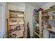 Functional walk-in pantry with ample shelving for organized storage at 538 E Rockwood Dr, Phoenix, AZ 85024
