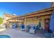 Cozy covered patio featuring comfortable seating, outdoor kitchen, and a relaxing ambiance at 538 E Rockwood Dr, Phoenix, AZ 85024