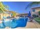 Sparkling pool with inviting blue water, complemented by a shaded pergola and comfortable lounge chairs for poolside enjoyment at 538 E Rockwood Dr, Phoenix, AZ 85024