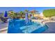 Inviting pool with clear blue water, mature landscaping, and ample seating, ideal for Gathering gatherings and summer fun at 538 E Rockwood Dr, Phoenix, AZ 85024