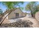 The backyard features desert landscaping, a storage shed, and a covered patio at 6335 E Brown Rd # 1065, Mesa, AZ 85205