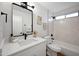This renovated bathroom features a shower-tub combo, bright lighting and stylish decor at 6335 E Brown Rd # 1065, Mesa, AZ 85205