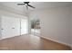 Bright bedroom with vaulted ceiling, sliding glass doors to backyard, and laminate floors at 6335 E Brown Rd # 1065, Mesa, AZ 85205