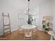 Chic dining space with modern chandelier, natural wood accents, and open layout at 6335 E Brown Rd # 1065, Mesa, AZ 85205