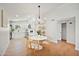 Stylish dining area with modern chandelier, open to a bright, updated kitchen at 6335 E Brown Rd # 1065, Mesa, AZ 85205