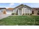 Charming single-story home featuring a well-maintained lawn and attached garage at 6335 E Brown Rd # 1065, Mesa, AZ 85205