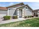 Inviting home with a well-kept lawn, clean lines, and decorative window awnings at 6335 E Brown Rd # 1065, Mesa, AZ 85205